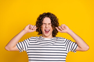 Portrait of aggressive stressed teenager hate his neighbors close ears do not like loud voice in...