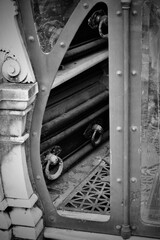Black and white image of exposed coffins in a mausoleum.