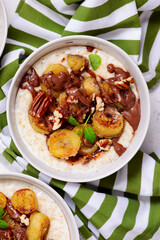 Oatmeal with caramel bananas and chocolate in to the bowl