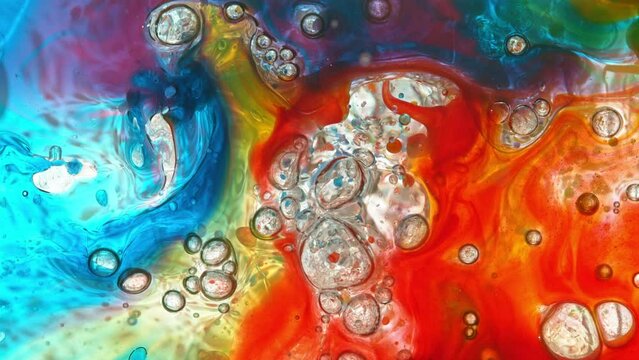 Super Slow Motion Shot of Moving Color Oil Bubbles on White Background . Filmed on High Speed Cinematic Camera at 1000fps.