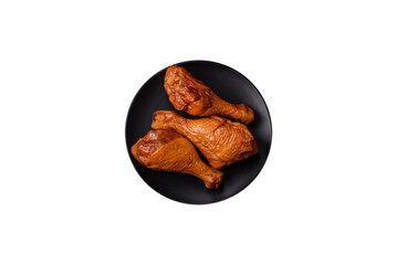 Delicious chicken legs baked on the grill with salt, spices and herbs