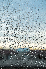 City window full of raindrops