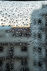 City window full of raindrops