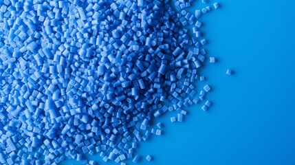 Blue plastic polypropylene granules on a table,
