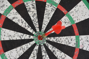 Dart in the Bullseye of a Dartboard