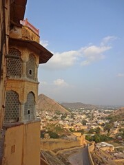 Aerial view of Jaipur city from Amber Fort, showcasing the vibrant colors and architectural beauty.  
