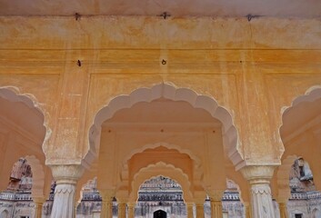 Architectural columns in Amber Fort, Jaipur, showcasing intricate designs and historical significance.