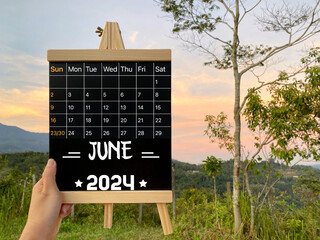 June 2024 calendar with nature background. Stock photo.