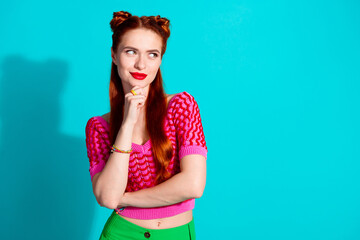 Photo of pretty thoughtful lady dressed pink knitted shirt arm chin looking empty space isolated blue color background