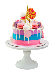 Bright unicorn cake with golden fondant horn, twisted lollipops, macaroons and meringues on neutral background