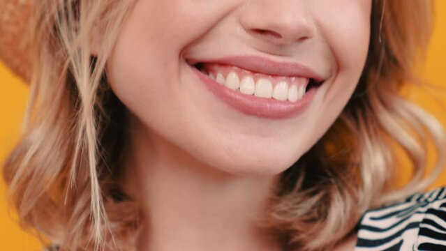 Dental care and stomatology concept. Closeup of happy caucasian woman smiling to camera, showing white smile of after teeth alignment procedure in studio