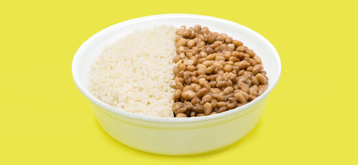 Brazilian food delivered at home, called marmitex, rice and beans in a 500 ml lunch box