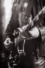 black and white photo, blurry photo. bokeh, guitar, music, guitarist, rock, metal, stage