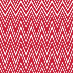 Seamless striped pattern with a traditional chevron design. Red and white zigzag wavy lines with different thicknesses. Geometric abstract background.