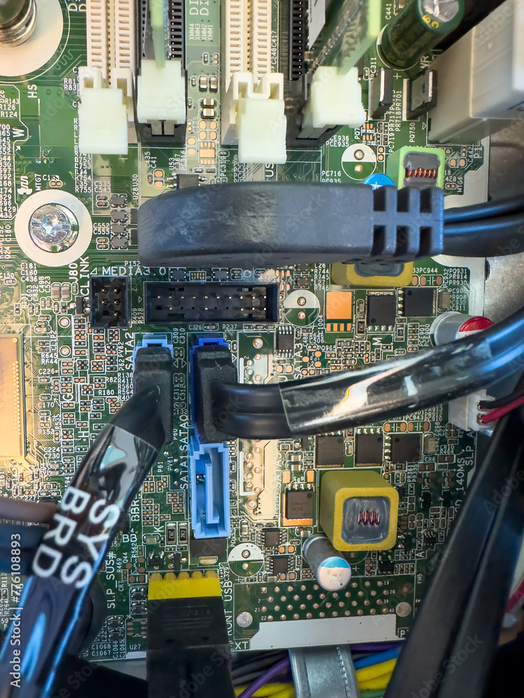 Poster close up of circuit board with microchips and other computer parts. cables and circuitry