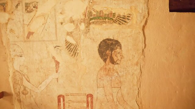 Interior of ancient egyptian tomb with paintings in siwa oasis, egypt.