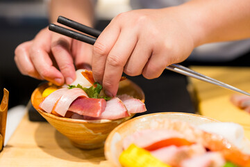 Japanese chef make of sashimi rice bowl - 776118622