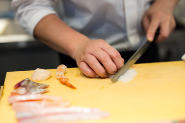 Obraz na płótnie Canvas Japanese chef make of sashimi rice bowl
