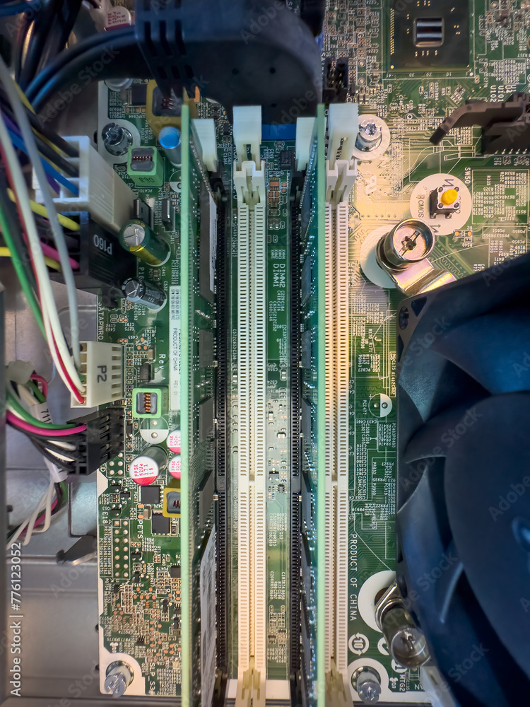 Poster close up of circuit board with microchips and other computer parts. ram memory slots