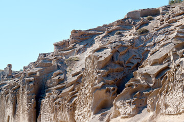 Detail of the Vlychada cliff on the southern tip of the island of Santorini, Greece.