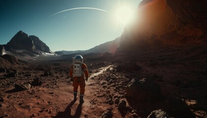 An astronaut in a vibrant orange suit hikes across a rocky Martian terrain, the horizon aglow with the light of a distant sun. - obrazy, fototapety, plakaty