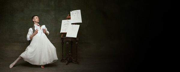 Banner. Young attractive man dressed in formal suit and dancing with white woman's dress fitting in his hands against vintage background. Copy space. Concept of self-expression, freedom, human rights.