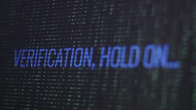 Verification, hold on message on the screen with falling code. High technology concept. Matrix-style visual effect.