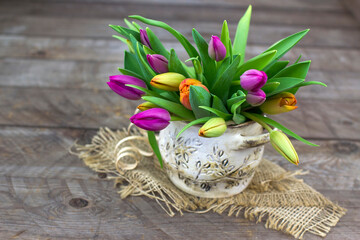 colorful tulips in a vase - 776149899