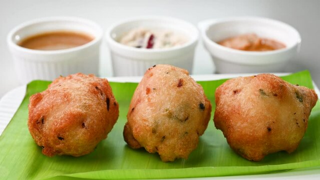 Serving mysore bonda on a banana leaf.