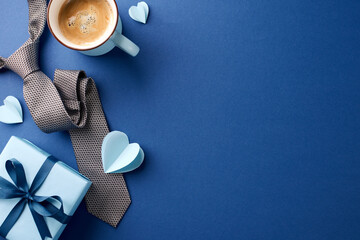 Celebrating Dad: Overhead view of a Father’s Day scene with a coffee cup, patterned tie, and gift...