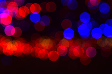 Red blue defocused bokeh lights blur sparkling colorful background lights Golden sparks glowing...