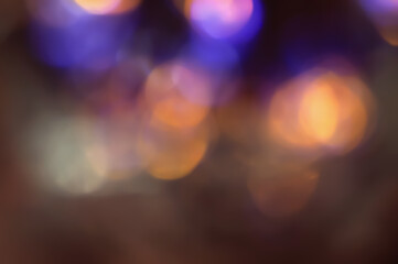 Defocused neon glow. Overlaying highlights. Futuristic LED lighting. Color bokeh blur on dark background
