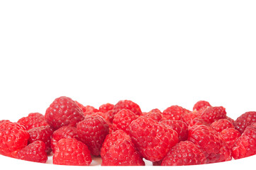 white plate with raspberries