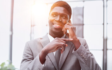 Portrait of a serious entrepreneur making a phone call