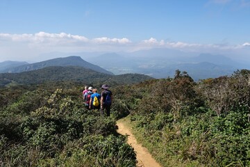 Beautiful scenery of Horton Plains National Park in Nuwara Eliya, Sri Lanka. Silhouettes of hiking...