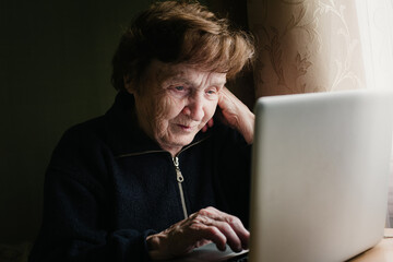 An old woman learning how to use a computer. - 776202476