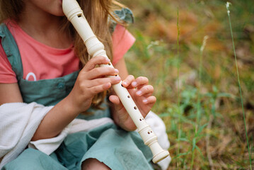 girl with violin in the forest. girl play music