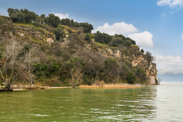 Tip of the Sirmione peninsula, where are the Grottoes of Catullus, ruins of a Roman villa (1st BC - 1st AD centuries), on the shore of Lake Garda, Brescia, Lombardy, Italy