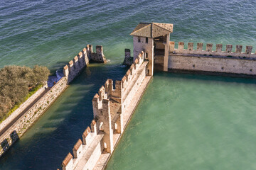Elevated view of the Scaliger Castle (13-14th centuries), rare example of medieval port fortification, on Lake Garda, Sirmione, Brescia, Lombardy, Italy