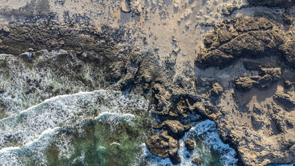 view from drone of rocks entering the sea on the island of El Hierro, Canary Islands