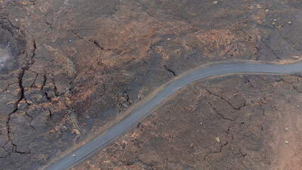 road between volcanic land from drone in mountain of El Hierro island, Canary Islands - obrazy, fototapety, plakaty