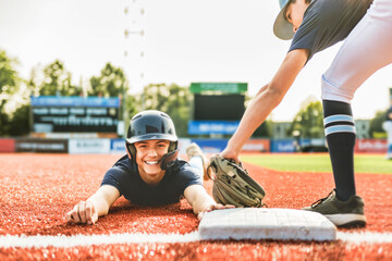 Young teen boy play baseball on a playground - obrazy, fototapety, plakaty