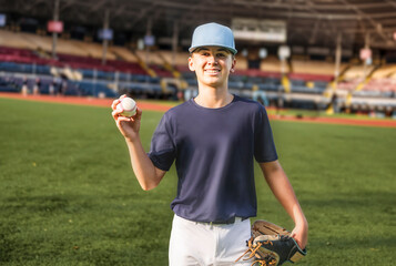 Young teen boy play baseball on a playground