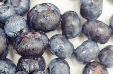 A bunch of blueberries are shown in a close up - 776210867