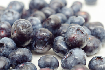 A bunch of blueberries are shown in a close up - 776211055