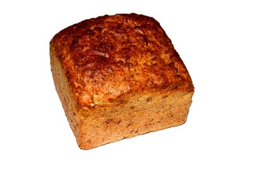 Very delicious wheat-rye bread with sunflower seeds on a white background