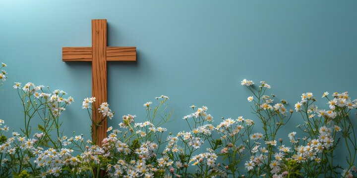 Cross on Blue Wall Among Flowers