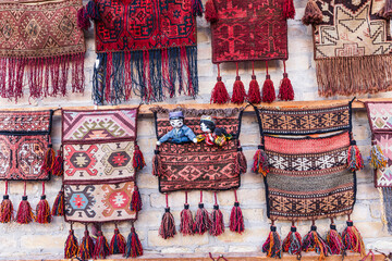 Embroidered hand bags displayed for sale in Bukhara. - 776225673