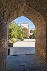 Arched entranceway to a courtyard at the Kukaldosh Madrasa in Bukhara. - 776226676