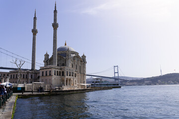 Photography of Ortakoy mosque in istanbul with the bridge linking the continents of Asia and Europe in the background. Copy space